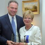 Official image of Virginia Governor Tim Kaine presenting the award to Carolyn LeCroy.